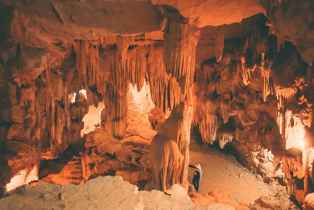 Every corner of the cave reveals a breathtaking interplay of light and shadow, painting an otherworldly scene